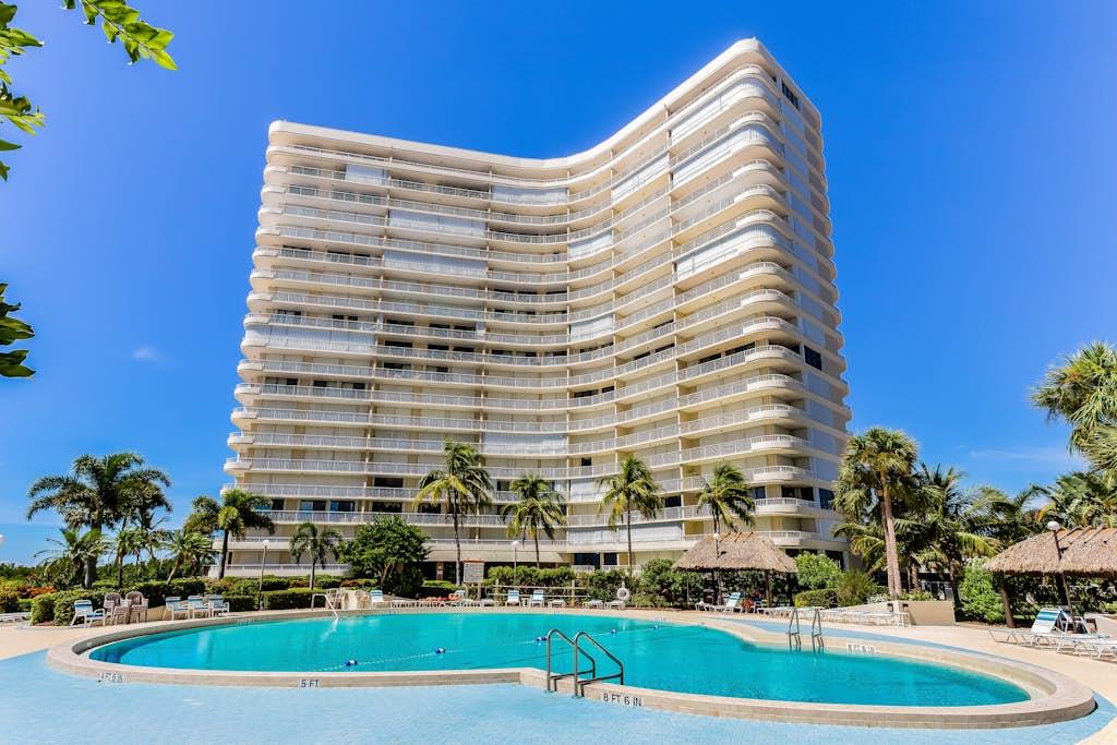 Beachfront condo tower and pool at a VueStay Southwest Florida vacation rental