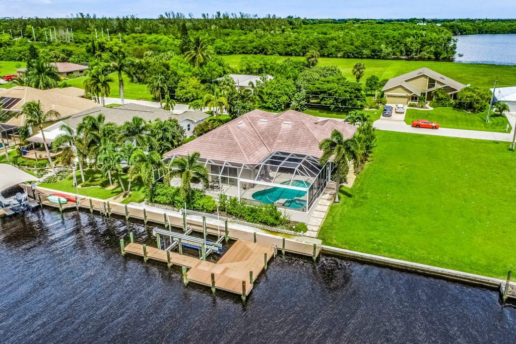 Aerial view of a waterfront VueStay home with a private dock in Southwest Florida